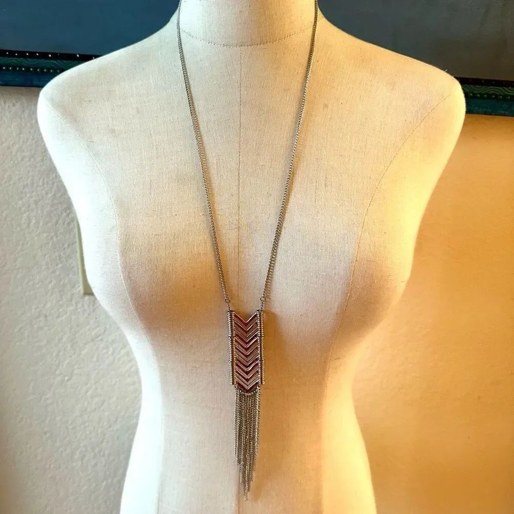 Long silver tone tassel pendant necklace